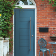 modern-door-surrounded-by-leaves-and-garden-furniture